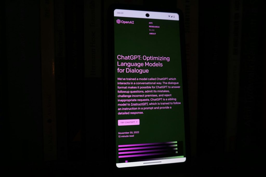 A smartphone with a lit-up screen in a dark room