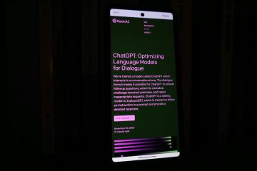 A smartphone with a lit-up screen in a dark room