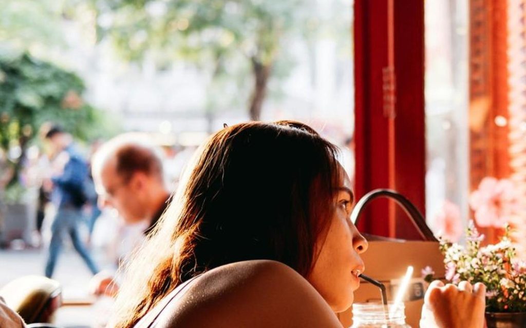 Woman smiling during a conversation in a café