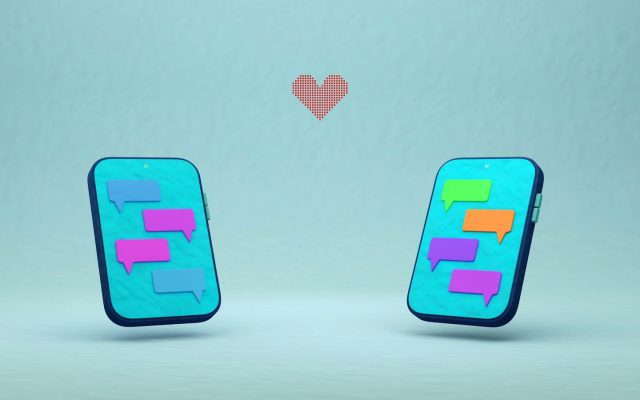 Two smartphones with chat bubbles and a red heart between them, illustrating online dating conversations